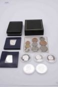 A collection of ten coins. including a silver proof Tristan da Chuna £5 coin, four silver proof