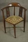 An Edwardian stained beech corner chair, with a double pierced splat back, the square section