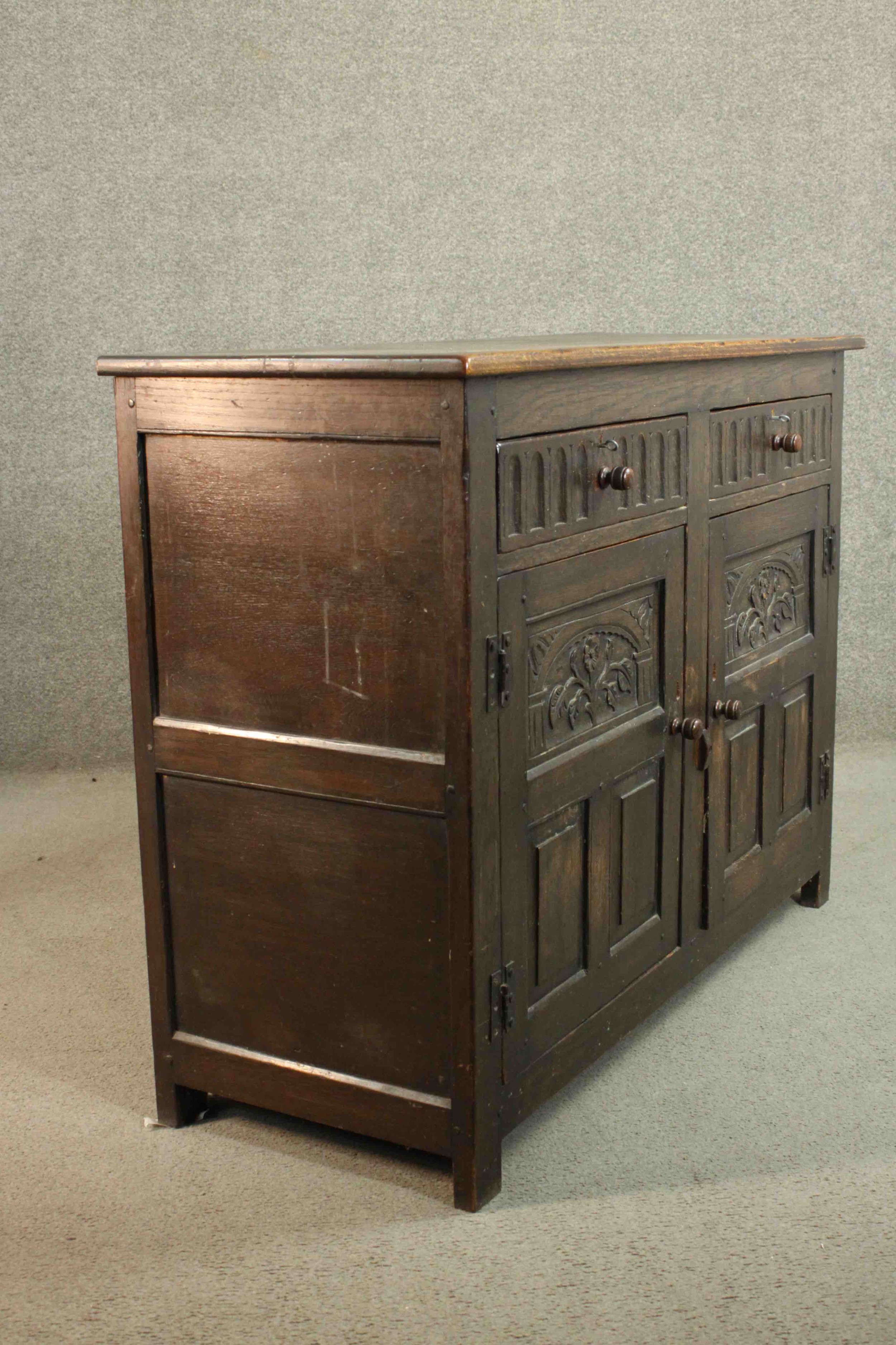 A country antique oak style sideboard fitted with carved drawers and drawers on block supports. H.91 - Image 10 of 11