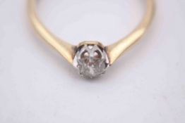 A boxed Edwardian gold and platinum old mine diamond solitaire diamond ring, set to centre with a