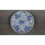 A very large Chinese 19th century porcelain blue and white hand painted charger decorated with