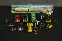 A collection of die cast models of vehicles, accessories and figures including, a boxed Dinky toys