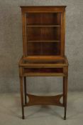 An Edwardian Sheraton revival display cabinet, crossbanded with satinwood and line inlaid, the upper