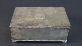 A Victorian silver plated box with rope design borders and coin motif to the centre. H.5 W.14 D.9cm