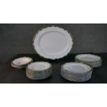 A Royal Worcester Connaught pattern hand painted part dinner service for twelve people. Makers