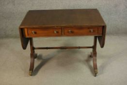 A Regency style mahogany sofa table of small size. H.69 W.152 (ext) 61cm.