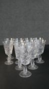 A collection of twelve hand cut Stuart crystal wine glasses with star cut bases. Maker's stamp to