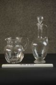 A hand cut Baccarat crystal Harcourt pitcher along with a hand blown handled glass decanter and