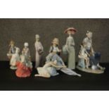 A collection of eight hand painted porcelain figures. Makers include Nao and Lladro. H.38 W.10 D.
