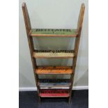 A gin advertising set of hanging wall shelves. 132 x 43 x 13 cm. Collection only.