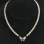 18ct diamond set butterfly and cultured pearl 39 cm necklace. 20 grams. Pearls 5.7 mm. UK Postage £