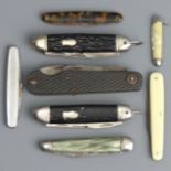 A collection of eight folding penknives, largest 10.5 cm closed. UK Postage £12.