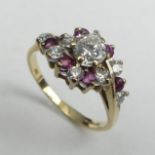 9ct gold Ruby and Diamond ring (centre stone approx. .4ct), London 1984, 2.7 grams. Size O, 9.7