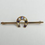 15ct gold horseshoe Sapphire and split pearl mounted 9ct gold bar brooch. 5.4 grams. 63 x 12 mm.