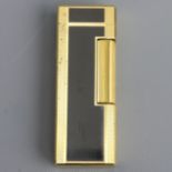 Dunhill gold plate and lacquer butane lighter in a leather holder. 65 mm. UK Postage £12.