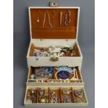 A jewellery box and contents including a compact, Victorian brooches and watches. UK Postage £16.