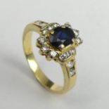 18ct gold Sapphire and Diamond ring, 4.9 grams. Size N 1/2, 11.8 mm wide. UK Postage £12.