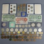 A box of mixed coins including some silver examples, along with some sets and notes. UK Postage £15.