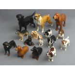 Three large Beswick pottery dogs along with twelve smaller ones. 14.5 cm tallest. UK Postage £20.