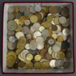 A box of assorted UK and Continental coins, including a 1942 half crown. UK Postage £16.
