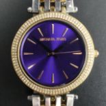 Michael Kors purple dial, stone set bezel, stainless steel and gold plate quartz watch, boxed. 39