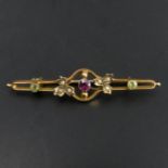 9 carat gold bar brooch stone set with Suffragette colours, 2.1 grams. 48 mm long. UK Postage £12.