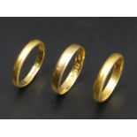 Three 22 carat gold wedding rings, various dates and sizes. 8.3 grams. Various dates and sizes. UK