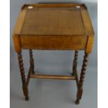 1930's child's oak desk with barley twist decoration. 48 cm wide x 75 cm high. Collection only.