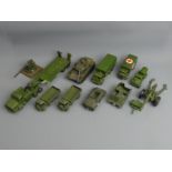 An uncollated collection of Dinky Army vehicles in played with condition. UK Postage £16.