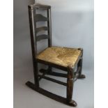 Ash and Elm rush seated rocking chair 47 cm wide x 80 cm high. Collection only.