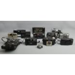 A collection of old and vintage cameras, including Pentax, Canon and Minolta (13). UK Postage £18.