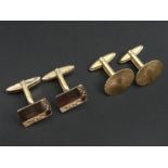 A vintage pair of 9 carat gold cufflinks, London 1970 and a pair of gold on silver examples. UK