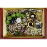 A leather box of mixed jewellery and watches, including stone set brooches. UK Postage £15.