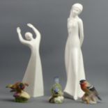 Royal Doulton figures Tomorrows Dreams and Awakening, along with three Royal Worcester bird figures.