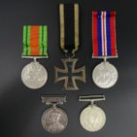 World War II service medal trio, German Iron Cross and a World War I long service replacement medal.