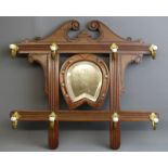 Edwardian walnut wall mirror/coat rack. 55 x 62 cm. Collection only.