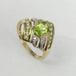 9 carat gold Peridot and Diamond ring, Birmingham 2005, 3.9 grams. Size S, 17.5 grams. UK Postage £