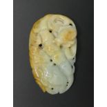 A well carved Chinese Jade pendant. 72 x 43 mm. UK Postage £12.