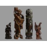 A group of four Chinese carved hardwood figures. Largest 37 cm. UK Postage £20.