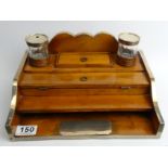 A Regency silver mounted fruit wood desk stand with two inkwells, London 1821. It bears a plaque