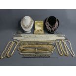 A box of mostly costume jewellery, including a silver ID bracelet and a blue stone line bracelet. UK