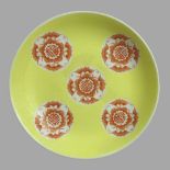A Chinese yellow ground and iron red bat design saucer dish, character mark to underside. 24 x 4.5