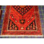 Rich red and blue ground, Persian hand woven, village rug. 300 x 155 cm. UK Postage £30.