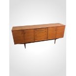 A stylish teak sideboard by Alfred Cox. Collection only.