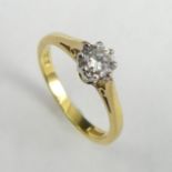 18 carat gold diamond (approx .25ct). 2.1 grams. Size H 1/2, 4.95 mm wide. UK Postage £12.
