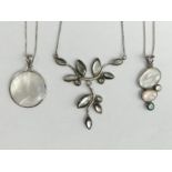 Two Sterling silver shell set pendant and chains and a similar necklace. 29.5 grams. UK Postage £12.