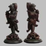 A pair of Chinese carved hardwood figures, circa 1900. 23 cm. UK Postage £14.