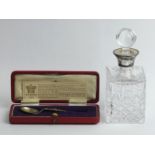 Silver 1937 Coronation spoon and a silver topped glass scent bottle, London 1995, 15.5 cm high. UK
