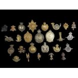 A collection of un-collated military cap badges (26). UK Postage £12.