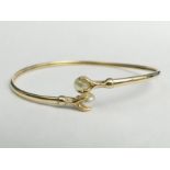 9ct gold faux pearl set bangle, 5.6 grams. UK Postage £12.